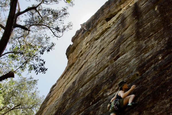 Indoor Climb South Coast: rock climber enjoying the spectacular weather and the challenge of this rock climbing cliff near Nowra.